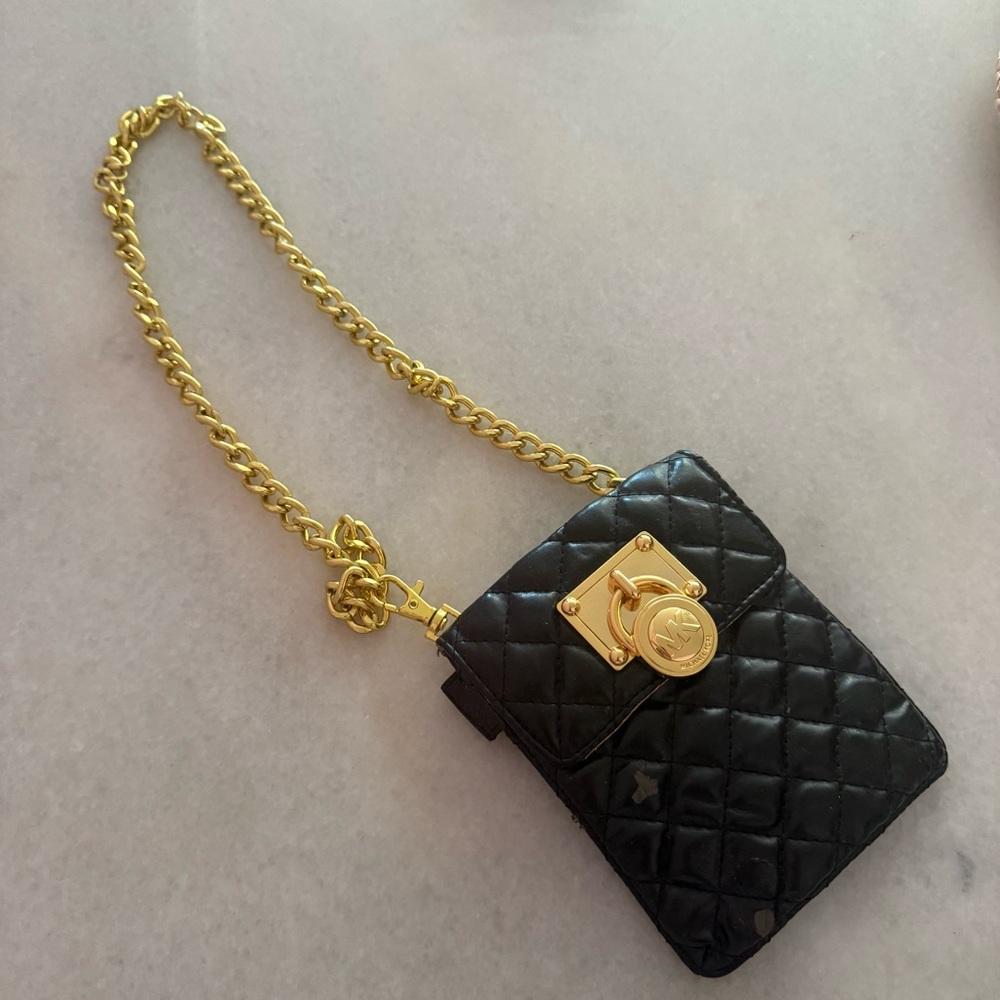 Michael Kors black leather with golden hardware bag